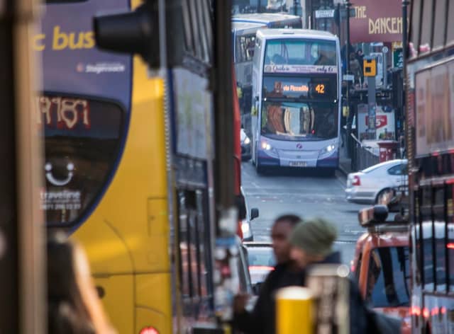 Buses on Oxford Road in Manchester Credit: TFGM