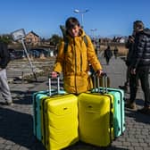 Ukrainians cross the Polish border on Thursday as they flee from their homeland Credit: Getty