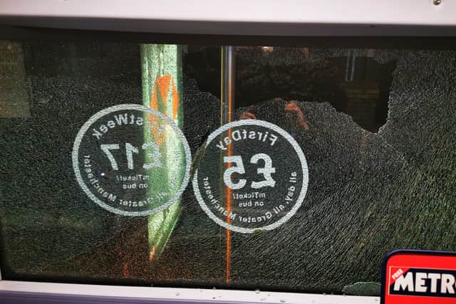 Damage caused to a First Manchester bus by vandalism