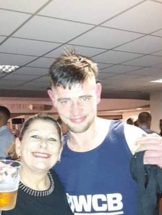 Christopher Hughes from Wigan with his mum, Susan Credit: family/GMP