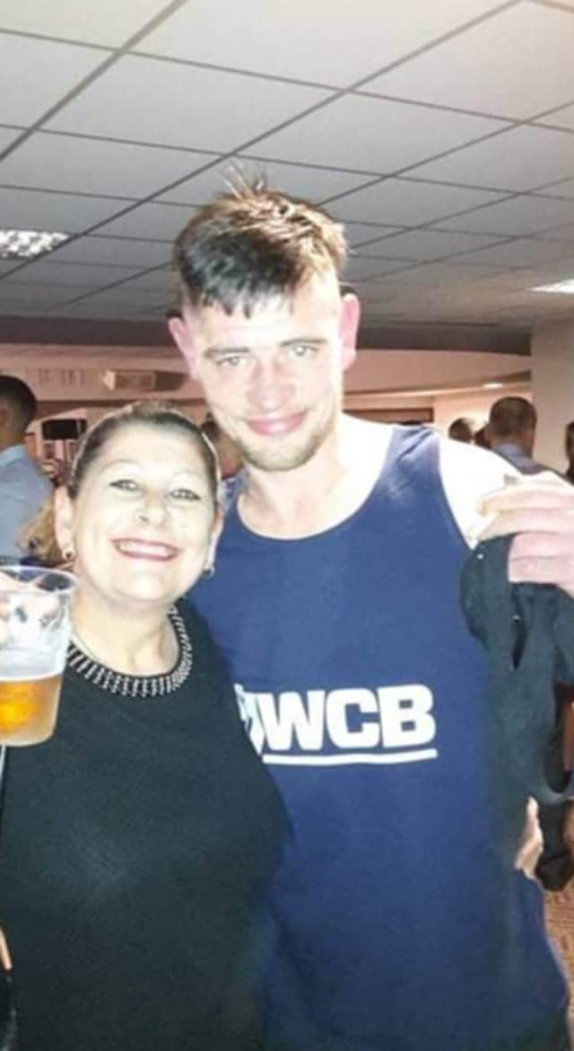 <p>Christopher Hughes from Wigan with his mum, Susan Credit: family/GMP</p>