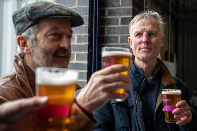 Raising a glass of the finished beer in memory of Dr Andy Fowell