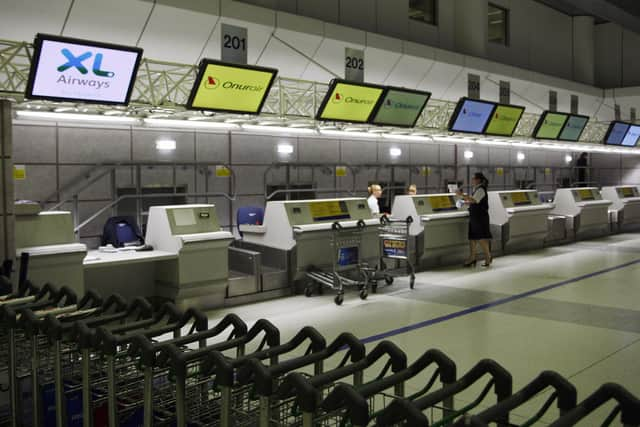 Check in desk at Manchester Airport.