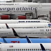 Airplanes sit at Manchester Airport.