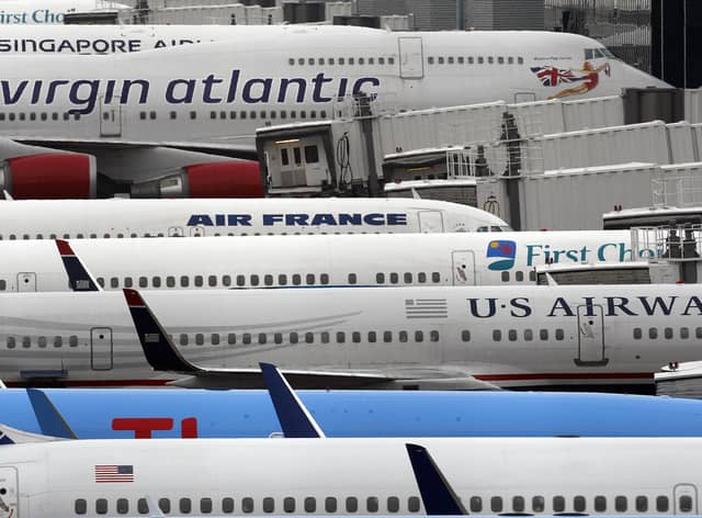 Airplanes sit at Manchester Airport.