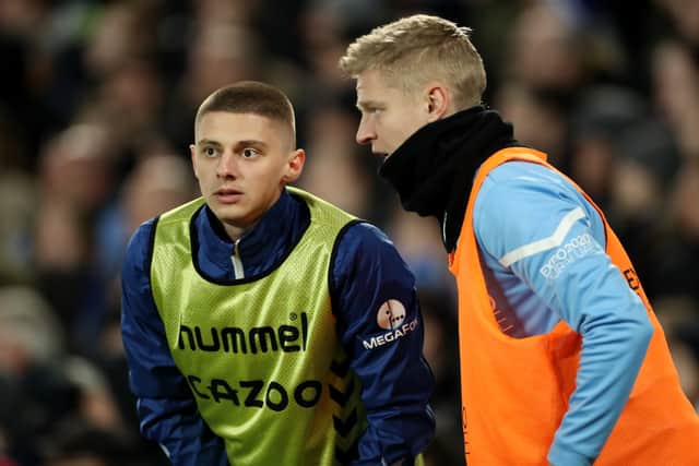 Oleksandr Zinchenko and Vitaliy Mykolenko chat during Everton 0-1 Manchester City. Credit: Getty.