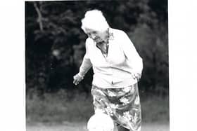 Alice Woods, who played for the Dick, Kerr Ladies, proving she had not lost her ball skills in her 80s