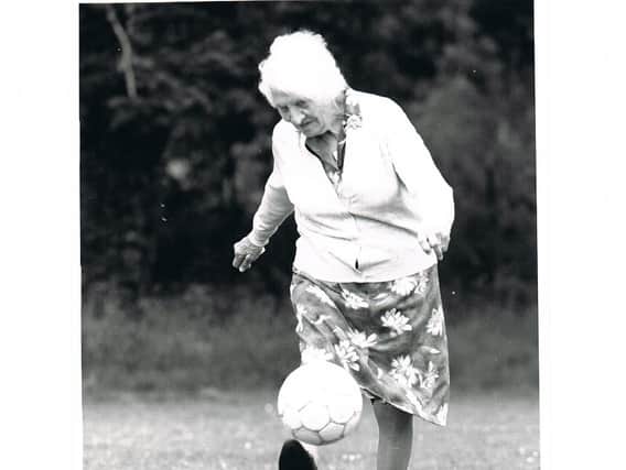 Alice Woods, who played for the Dick, Kerr Ladies, proving she had not lost her ball skills in her 80s