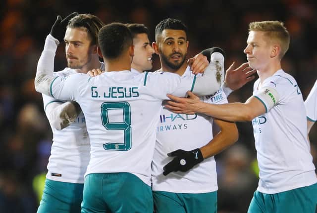 Riyad Mahrez and his teammates celebrate their first goal against Peterborough in the fifth round. Credit: Getty. 