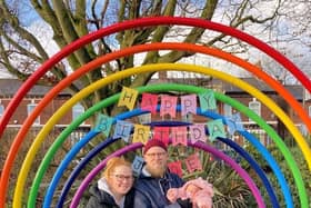 Jude’s parents at the Buddy Bench in his memory with their daughter Marnie