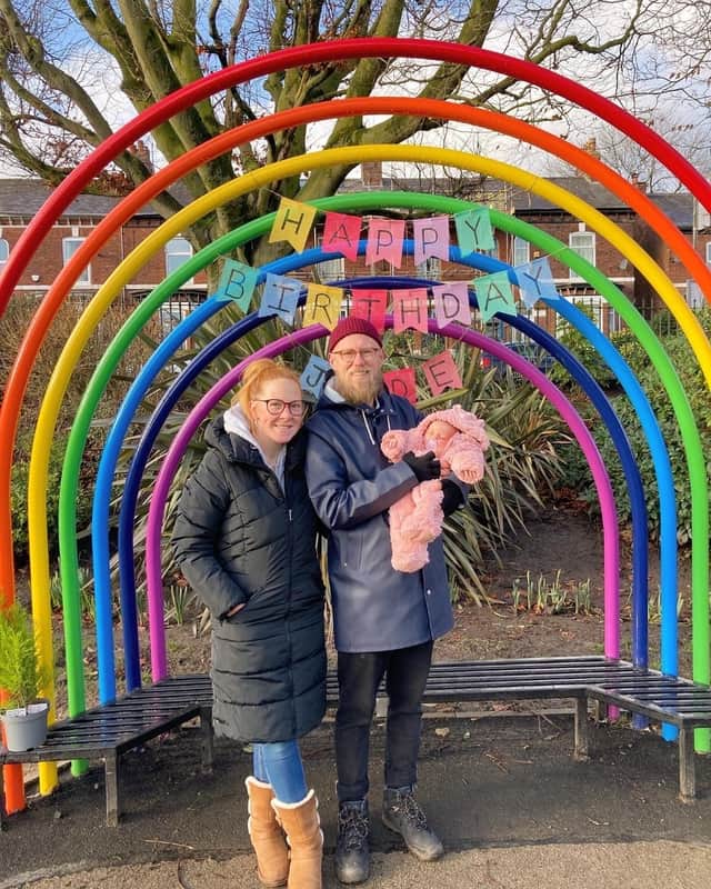 Jude’s parents at the Buddy Bench in his memory with their daughter Marnie