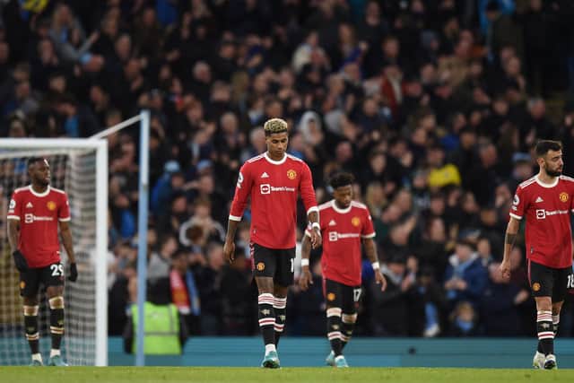Manchester United players look despondent at the Etihad. Credit: Getty.