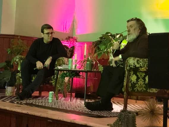 Andy Burnham and Ricky Tomlinson chatting on stage at Salford Lads Club