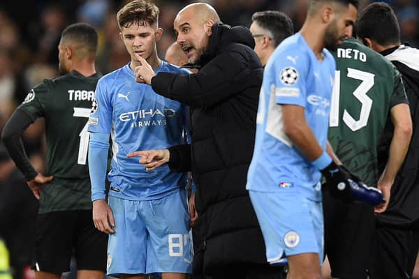 Pep Guardiola gives instructions to James McAtee in the 0-0 draw with Sporting. Credit: Getty.