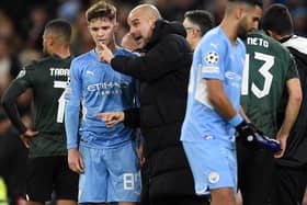 Pep Guardiola gives instructions to James McAtee in the 0-0 draw with Sporting. Credit: Getty.