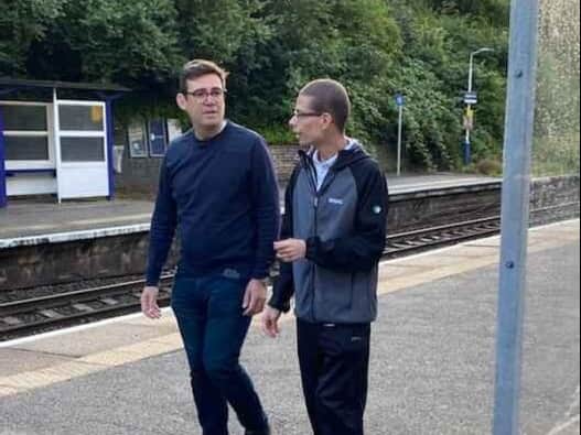 Nathaniel Yates (right) shows Andy Burnham some of the accessibility issues on the railway network