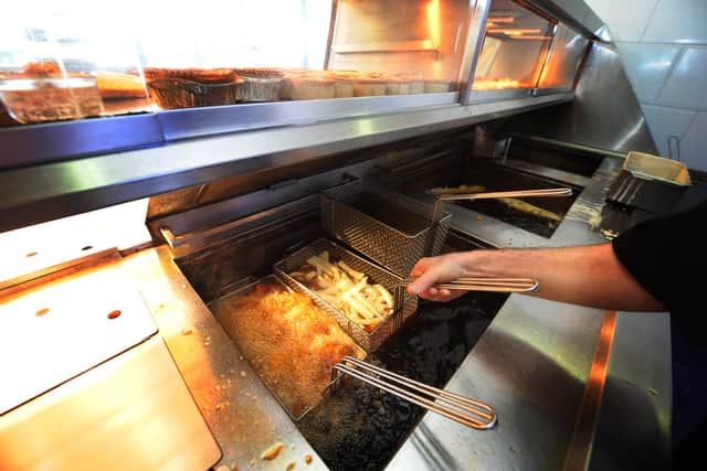 Chips are fried at a Fish and Chip Takeaway in Manchester Credit: AFP/ Getty
