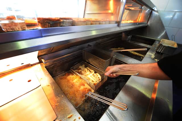 Chips are fried at a Fish and Chip Takeaway in Manchester Credit: AFP/ Getty