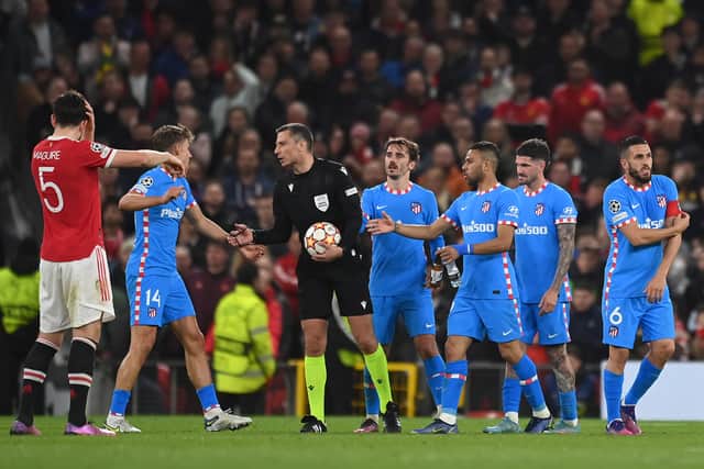 Atletico regularly surrounded referee Slavko Vincic on Tuesday night. Credit: Getty.