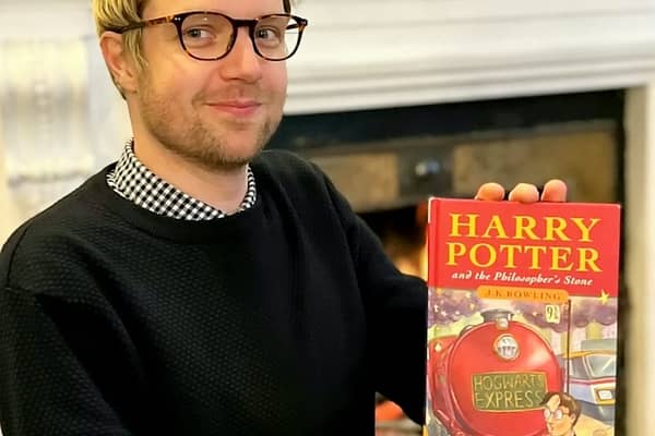 Jim Spencer with the pristine first edition of Harry Potter and the Philosopher’s Stone sold by a Sussex man.   Credit: Hansons / SWNS