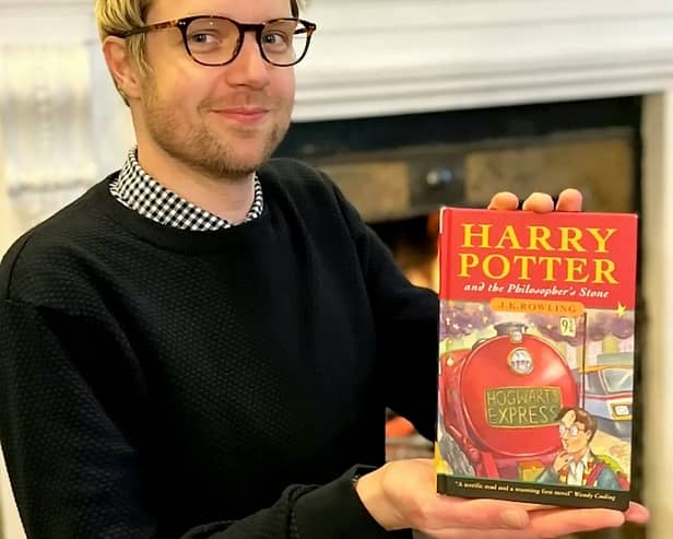Jim Spencer with the pristine first edition of Harry Potter and the Philosopher’s Stone sold by a Sussex man.   Credit: Hansons / SWNS