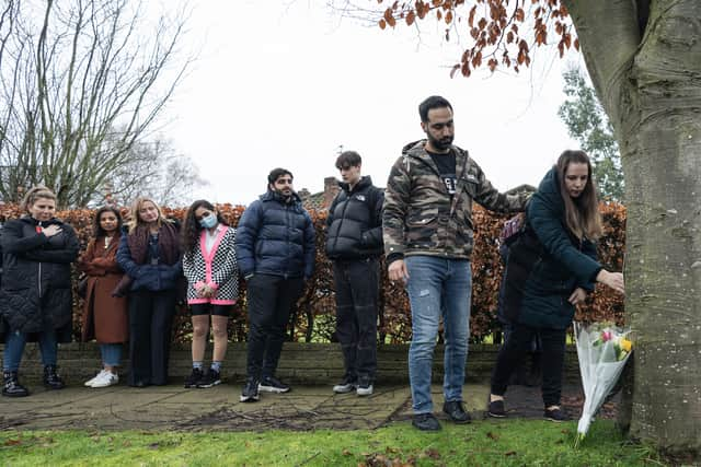 Flowers being laid at a memorial where Yousef was stabbed