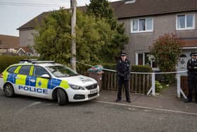 The scene at Bidston Avenue St Helens after dog mauled child to death Credit: SWNS