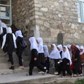 Girls arriving at a school in Afghanistan, just hours before the Taliban reversed a decision to allow them to learn once again. Photo: AFP via Getty Images