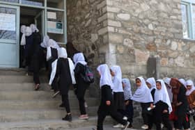 Girls arriving at a school in Afghanistan, just hours before the Taliban reversed a decision to allow them to learn once again. Photo: AFP via Getty Images