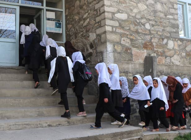 <p>Girls arriving at a school in Afghanistan, just hours before the Taliban reversed a decision to allow them to learn once again. Photo: AFP via Getty Images</p>