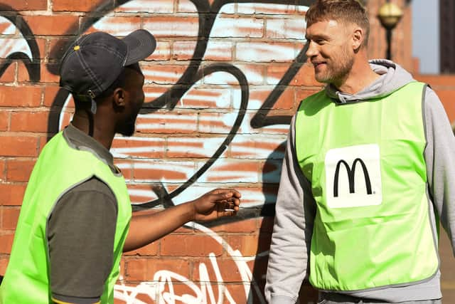 Freddie Flintoff chats to a fellow litter-picker