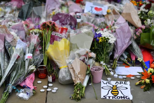 Flowers and candles placed in St Peter’s Square in 2017 after the Manchester Arena terror attack. Photo: AFP via Getty Images 