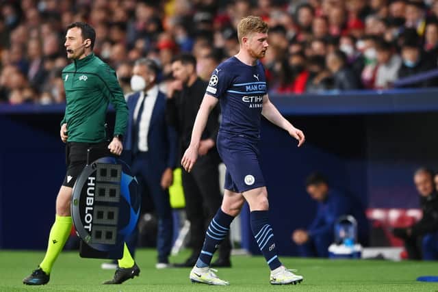 Kevin De Bruyne limps off during Man City’s Champions League clash at Atletico Madrid. Picture: Shaun Botterill/Getty Images