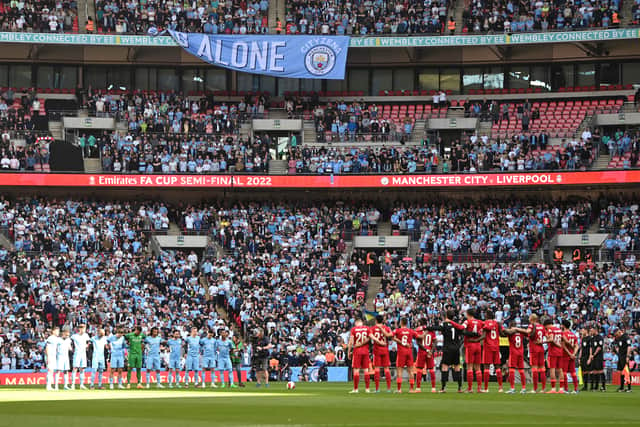 Both teams stood before the game to mark 33 years since the Hillsborough Disaster. Credit: Getty.