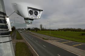 A Manchester Clean Air Zone automatic number plate recognition camera Credit: Getty 