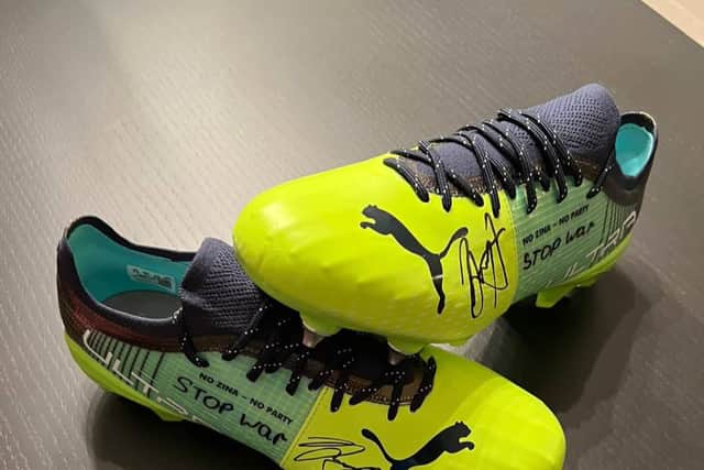 The boots worn by Oleksandr Zinchenko which are being auctioned