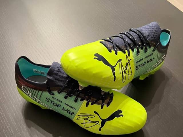 The boots worn by Oleksandr Zinchenko which are being auctioned