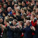 By contrast, Liverpool fans applauded in support of Ronaldo on Tuesday Credit: Getty