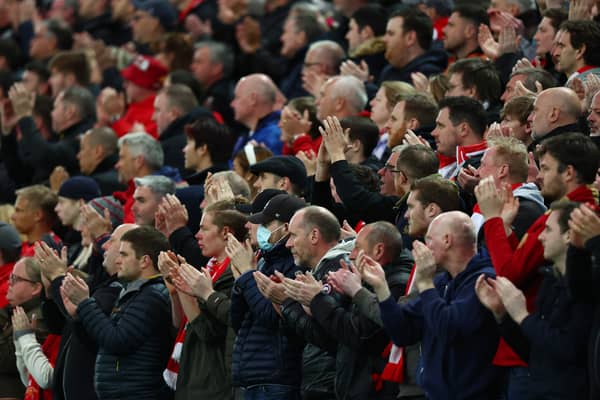 By contrast, Liverpool fans applauded in support of Ronaldo on Tuesday Credit: Getty