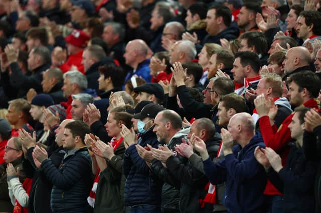 <p>By contrast, Liverpool fans applauded in support of Ronaldo on Tuesday Credit: Getty</p>