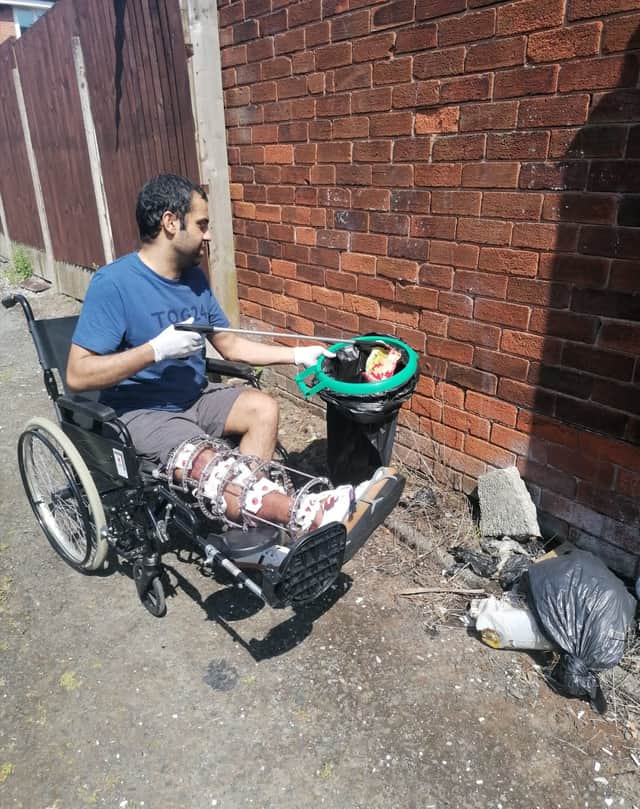 Imran Choudhury litter picking around the hospital, where he raised £2,500 Credit: Imran Choudhury / SWNS