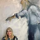 Ghislaine Howard with one of her paintings