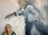 Ghislaine Howard with one of her paintings