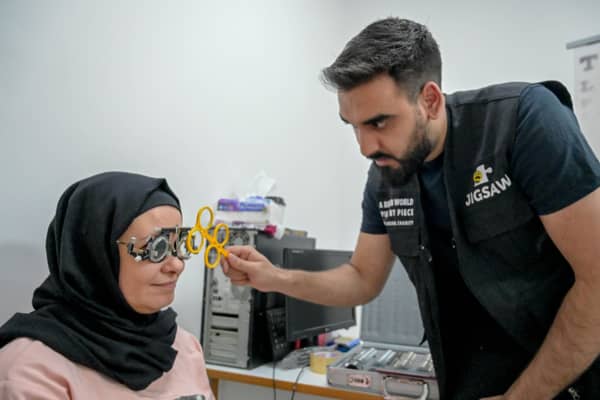 Optometrist Yousuf Mohammad performing an eye test