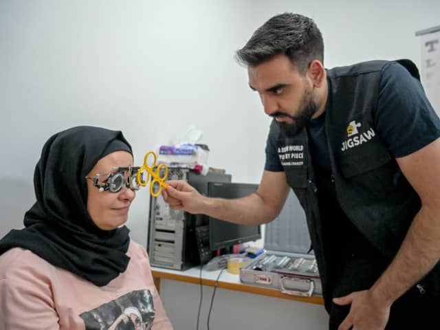 Optometrist Yousuf Mohammad performing an eye test