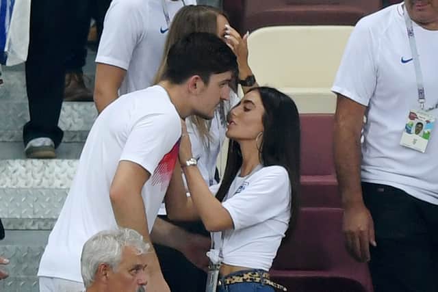 Harry Maguire of England is consoled by his girlfriend Fern Hawkins following England's defeat in the 2018 FIFA World Cup Russia Semi Final 
