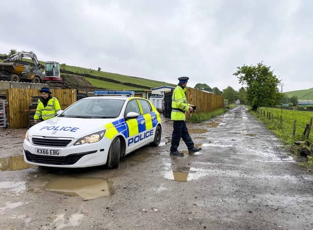 <p>Police at the scene in Carr Lane, Milnrow, Rochdale Credit: Matthew Lofthouse SWNS</p>