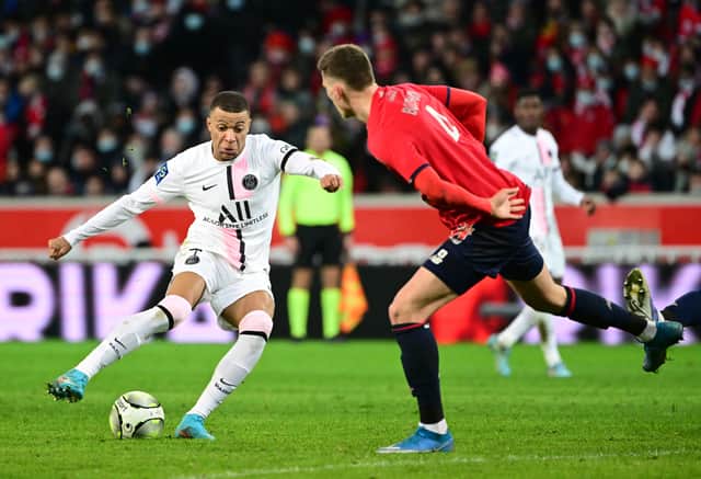 Sven Botman attempts to defuse the threat of Kylian Mbappe.