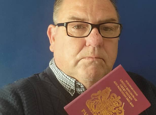 <p>David Chadwick with his passport Credit: David Chadwick / SWNS</p>