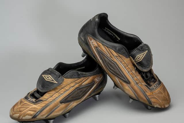 Wayne Rooney’s boots, worn when he scored his first Premier League goal in October 2002, at the age of 16 Credit: Graham Budd Auctions / SWNS
